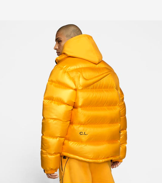 Gelbe Nike x Drake NOCTA Daunenjacke